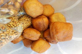 Stella training a fellow young person on bakery (replace with actual photo)